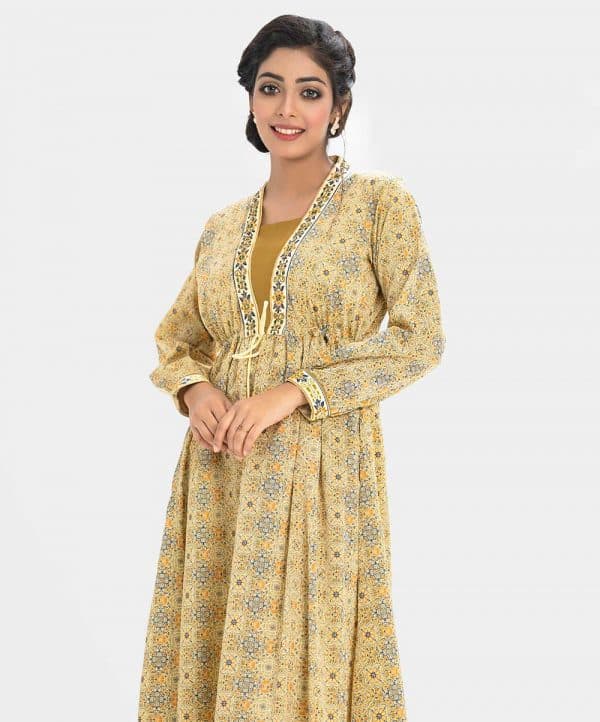 Women's all over printed gown abaya in crepe fabric. High neck with karchupi work, full sleeves and gathered waistline with tie-cord.
