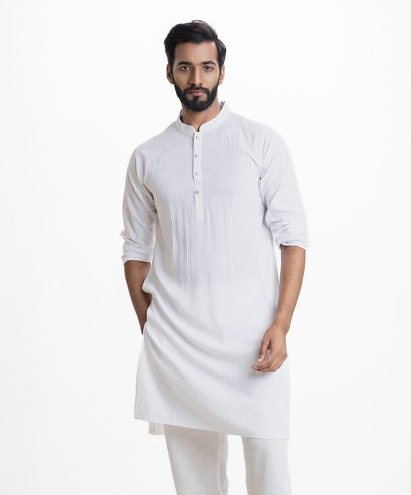Men's all over printed slim fitted panjabi in viscose fabric. Mandarin collar, full sleeves. Inseam pockets. Line stitching at collar and placket.