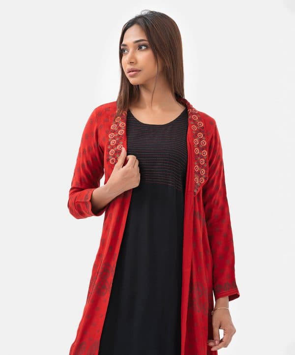 Women's A-line tunic with shrug in silk & viscose blended fabric. The shrug features three-quarter sleeves, shawl collar with karchupi details. Paired with an attached viscose tunic.